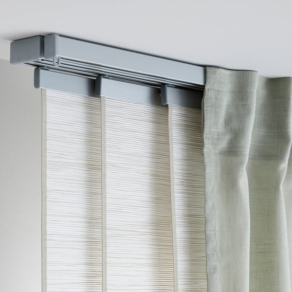 VIDGA curtain rail on wall, flexible & easy to assemble, holds multiple curtains for privacy and light control.