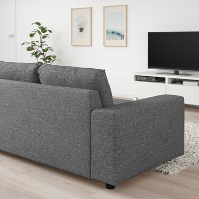 Sure, here is a concise and informative for modern grey VIMLE sofa in living room with tv and decor.