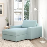 Light blue VIMLE chaise lounge sofa, spacious and modern, positioned near large window, with storage and adjustable headrest.