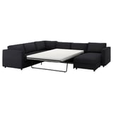 The VIMLE sectional sofa in dark gray a convertible sofa bed with a white mattress, providing a multifunctional seating and sleeping solution.