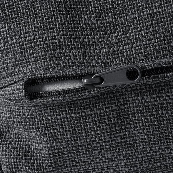 Close-up of high-quality zipper on soft, textured fabric, showcasing durability and comfort.
