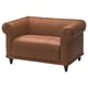 Brown leather VISKAFORS armchair, round shape, tufted design.