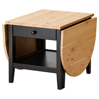 ARKELSTORP salontafel. Natuurlijk houten blad, donkere basis. Klapbladeren, lade, opbergplank.