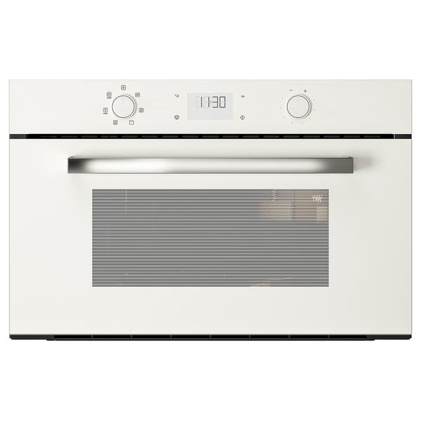 Een witte BEJUBLAD magnetron met strak design en metalen handvat.