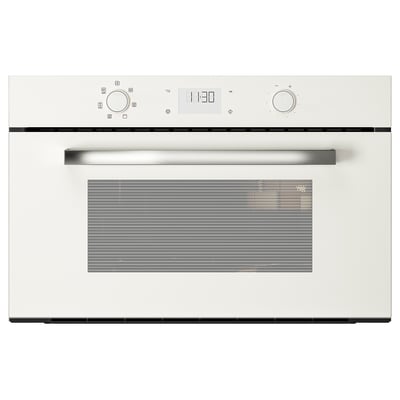 Een witte BEJUBLAD magnetron met strak design en metalen handvat.