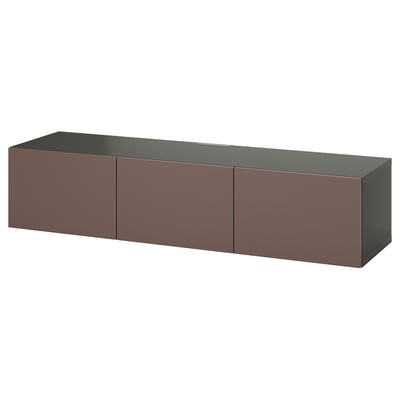 Een ikea BESTÅ tv-meubel in donkerbruin. Het heeft drie lades en een smal bovenoppervlak, ideaal voor moderne woonruimtes.