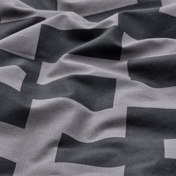 Abstract grijs dekbedovertrek met golvende geometrische patronen, met zachte, glanzende stof.
