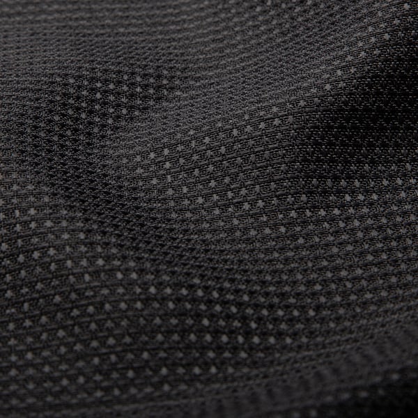 Close-up van waterafstotende, getextureerde polyesterstof met wafelpatroon.