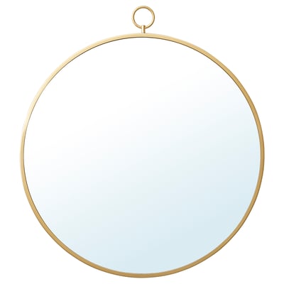 Een ronde, messingkleurige GRYTÅS spiegel met een metalen frame en standaard. Het kan hangen of staan en voegt elegantie toe aan elke ruimte.