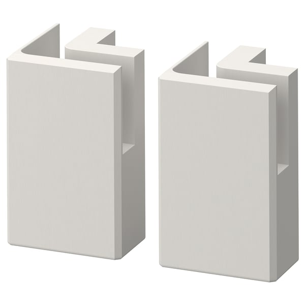 Twee witte rechthoekige houten blokken met afgeschuinde randen en ingezette panelen, naast elkaar gestapeld.