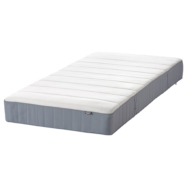 IKEA MALM twin matras, wit met grijze zijkanten, stevig schuimoppervlak, rechthoekige vorm.