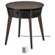 Moderne ikea STARKVIND luchtreiniger op donkere houten tafel met schuine poten en zwart gaas front.
