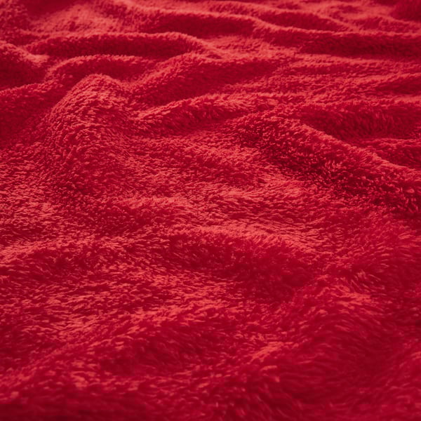 Zachte, rode fleece stof, close-up textuur, gezellig en warm.