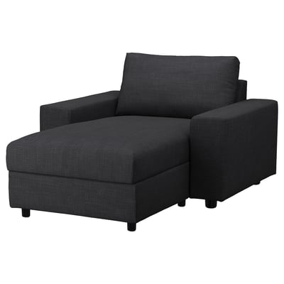 Een VIMLE zwarte stoffen bank met ingebouwde opbergruimte, strak design en moderne stijl.