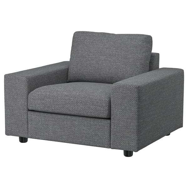 Een grijze VIMLE fauteuil met een modern design en comfortabele vulling.