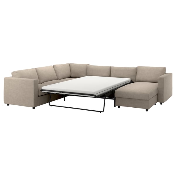 Een beige VIMLE sectionele bank met een ingebouwd bed.