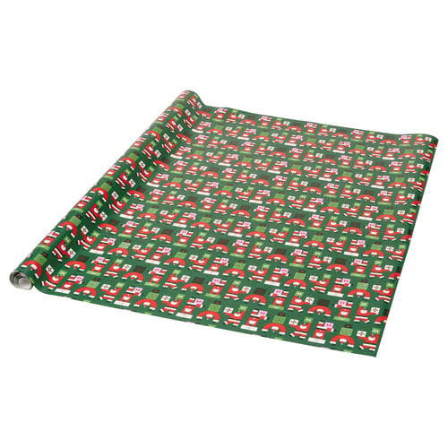 Groen cadeaupapier met rode, witte en kerstmanontwerpen.