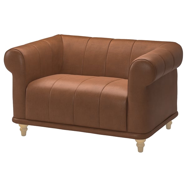 Bruin lederen VISKAFORS fauteuil, ronde vorm, diepe zitting, houten poten.