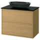 Modern oak bathroom vanity with black countertop and glass basin.