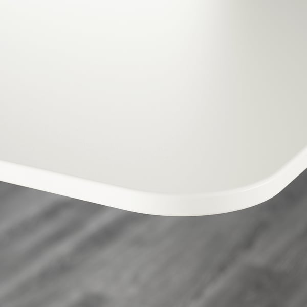 Sleek, minimalist white desk with smooth, rounded edges. Modern design, high-quality finish.