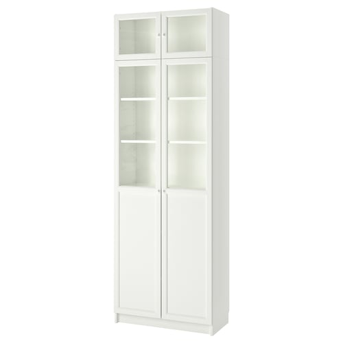 White BILLY bookcase with glass doors, tall and rectangular, has a modern design with adjustable shelves.