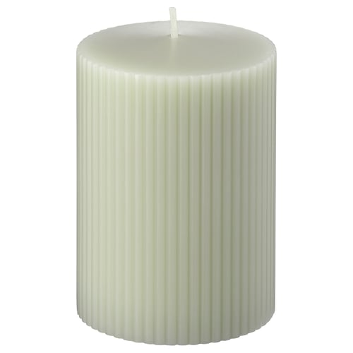 White GLASBJÖRK candle, ribbed design, standing upright.