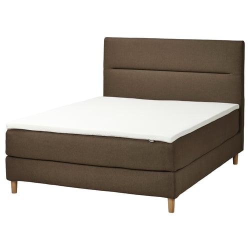 Modern olive-green bed with a soft, padded headboard and wooden legs, showcasing HEMFJÄLLET design.