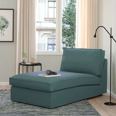 KIVIK chaise: teal, sturdy, l-shaped, soft fabric, fits well in room, near lamp.