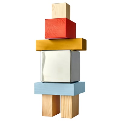 KONSTRUNDA: stainless steel, pine blocks in red, gold, blue, stacked in colourful, geometric tower.