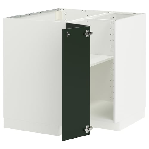 A white METOD kitchen cabinet set with dark green doors. It has adjustable shelves and is designed for versatile storage.
