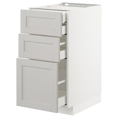White METOD kitchen cabinet with 3 drawers and a door, light grey fronts, bevelled edges.