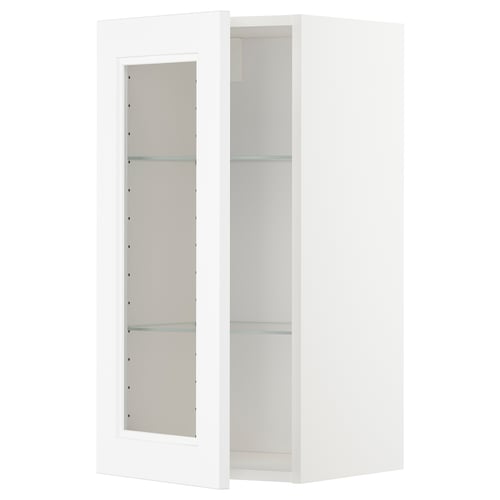 A white METOD kitchen wall cabinet with glass shelves, modern design.