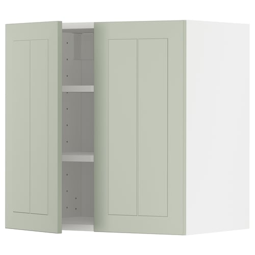 A light green METOD kitchen cabinet with two doors and adjustable shelves, set against a white background.