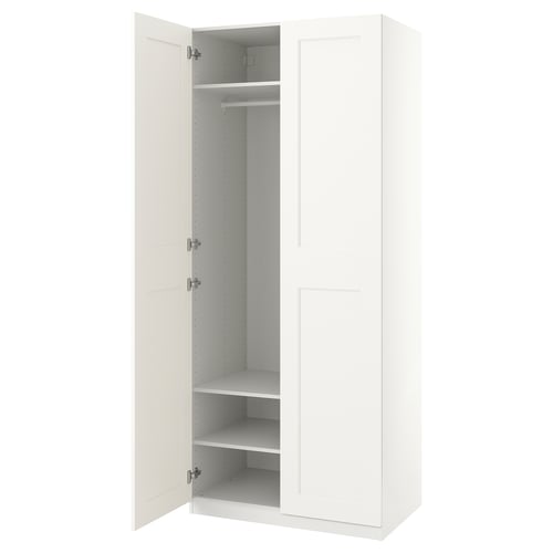 A PAX wardrobe in white with one door open, revealing an empty closet space with shelves inside.