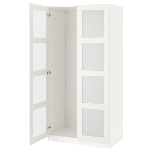 A white PAX wardrobe with mirrored doors and adjustable feet for stability.