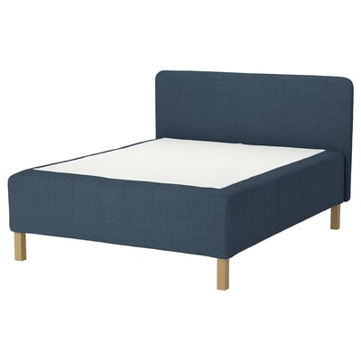 Dark blue fabric bed with sleek headboard and wooden legs.