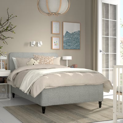 Modern bedroom with grey RISHÖJDEN bed, art, and large window.
