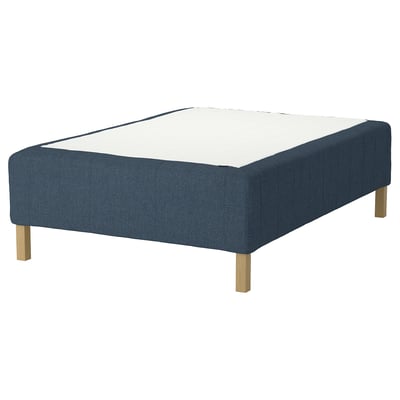 Blue fabric platform bed base with wooden legs, no headboard or footboard.