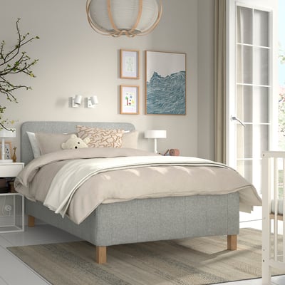 Modern bedroom with RISHÖJDEN bed, light grey, upholstered headboard, king size, white walls, artwork, window, side tables.