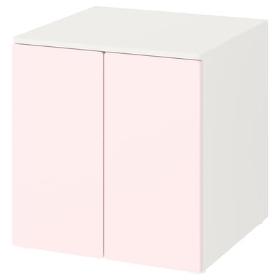 A white and light pink SMÅSTAD cube storage unit with soft-closing doors.