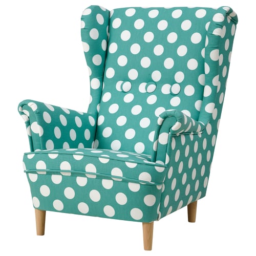 Kids green polka dot chair with high back and wood legs.