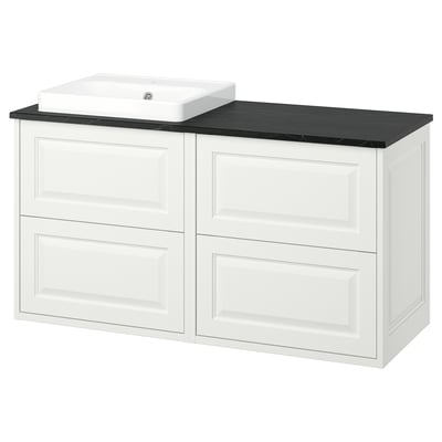 A white TÄNNFORSEN bathroom vanity with drawers, a black countertop, and a built-in ceramic sink.