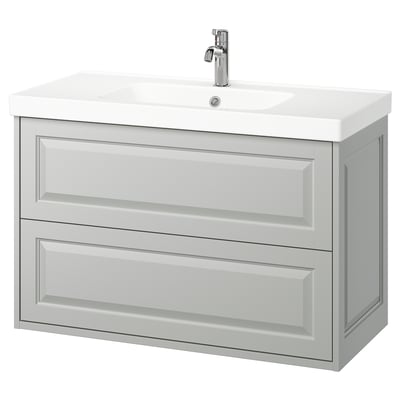 Wall-mounted light grey bathroom vanity, rectangular with two drawers, ceramic sink, chrome tap.