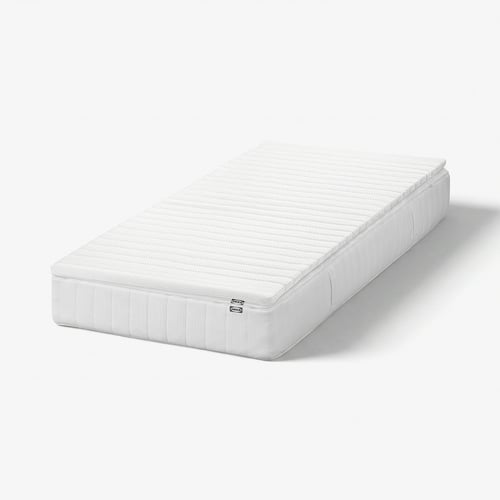 IKEA VÅLFJÄLLET white rolled mattress with recycled polyester, rectangular shape, and visible stitching.