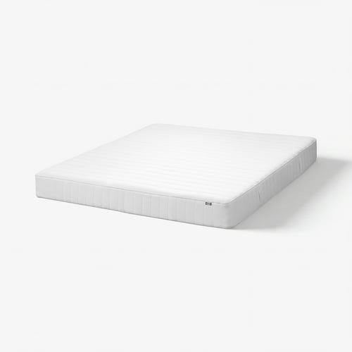 A white VÅLFJÄLLET mattress with a textured top and rectangular shape. Its designed for comfort with five support zones.