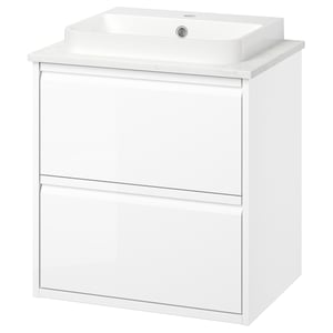 Modern white bathroom vanity with sleek design, featuring a marble countertop and integrated handles.