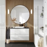 Modern white bathroom with large mirror, sleek ÄNGSJÖN vanity in glossy white, marble basin, wood panels behind, black accents.