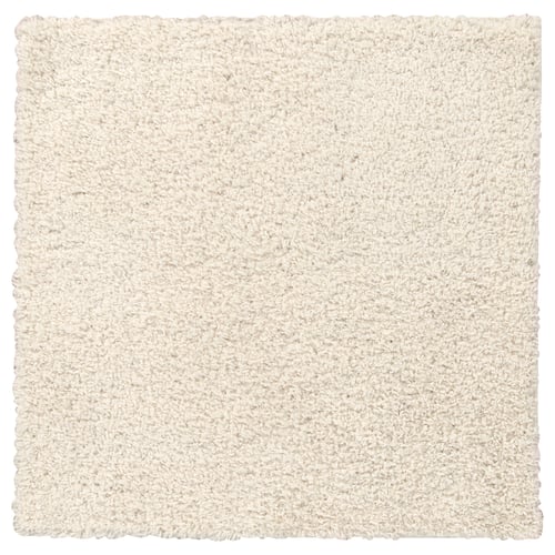 A square, ivory-colored, shaggy arende area rug with soft texture.