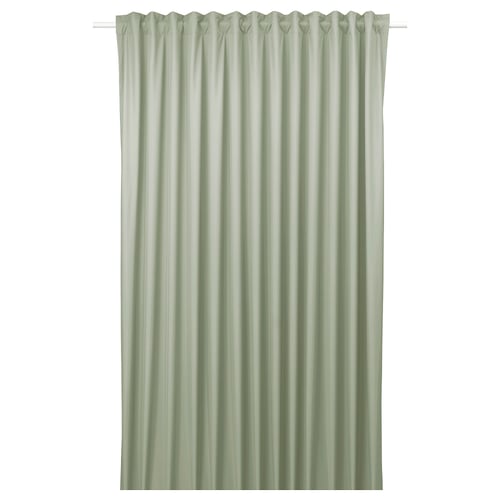 BENGTA green blockout curtain with peach skin texture. Simple, rectangular design, hangs neatly with heading tape.