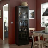 Modern living space: BESTÅ unit with cups, doorway, lights.